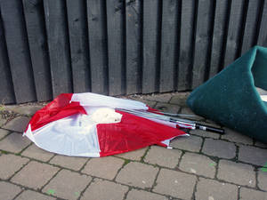 red white broken umbrella